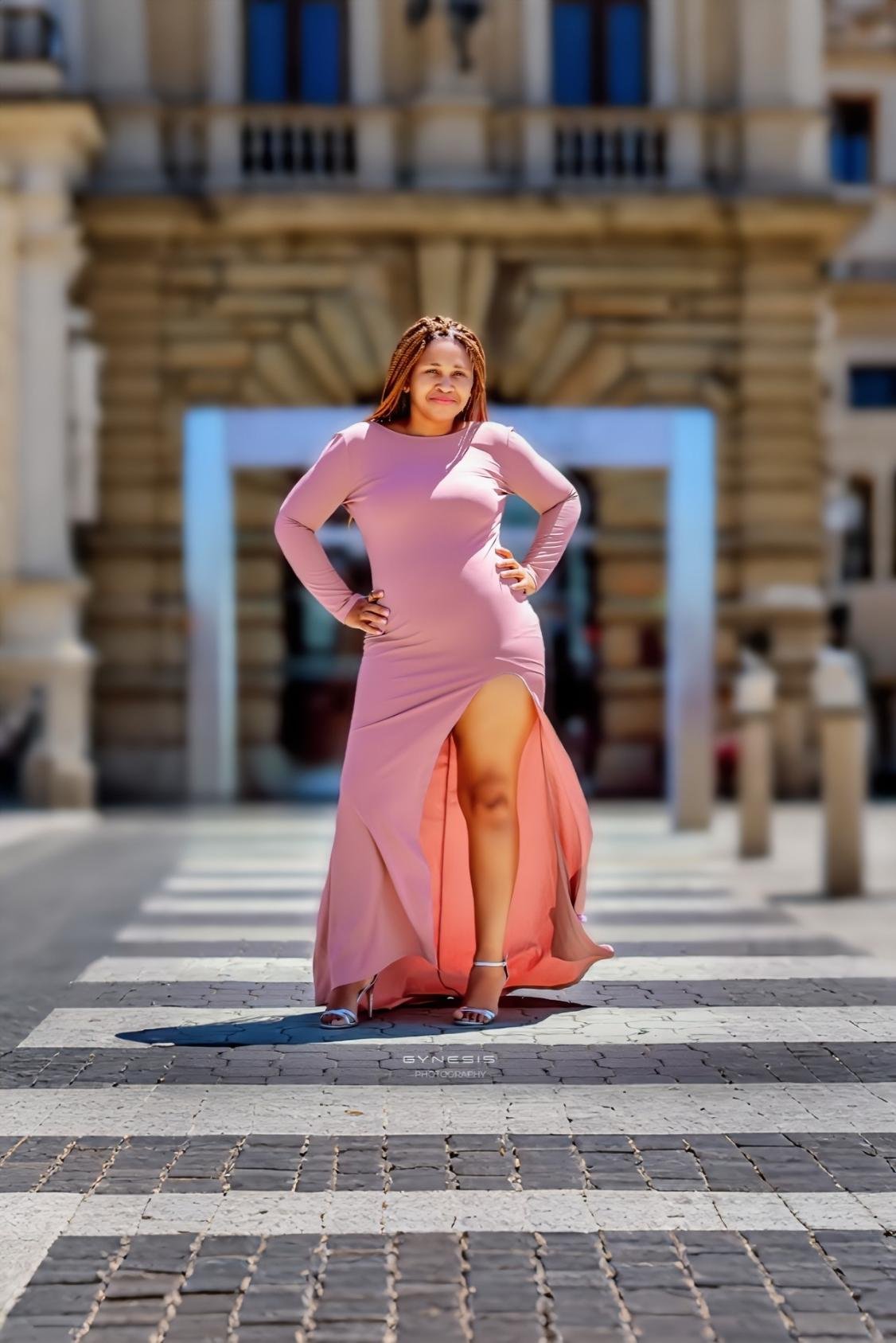 Birthday photoshoot in Pretoria, Pretoria West, Pretoria North, Gauteng, South Africa featuring a model in a pink gown with a high slit posing confidently.